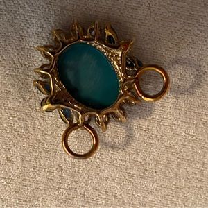 Cameo necklace enhancer surrounded by amethyst and sapphire stones gold